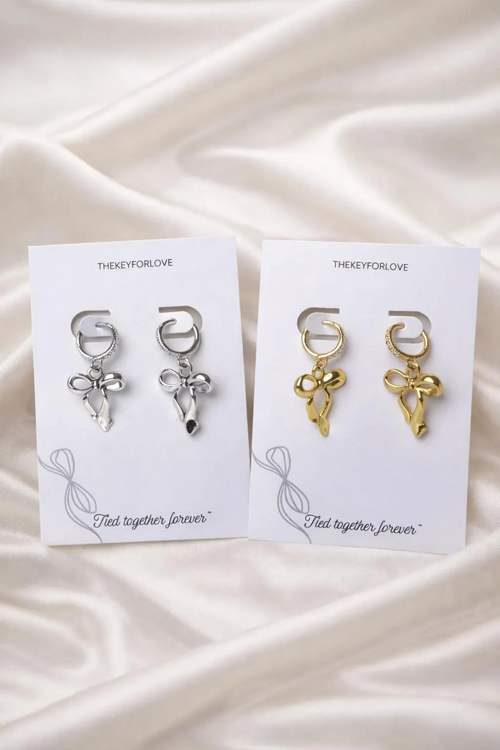Bow huggie hoop earrings sparkly silver and gold