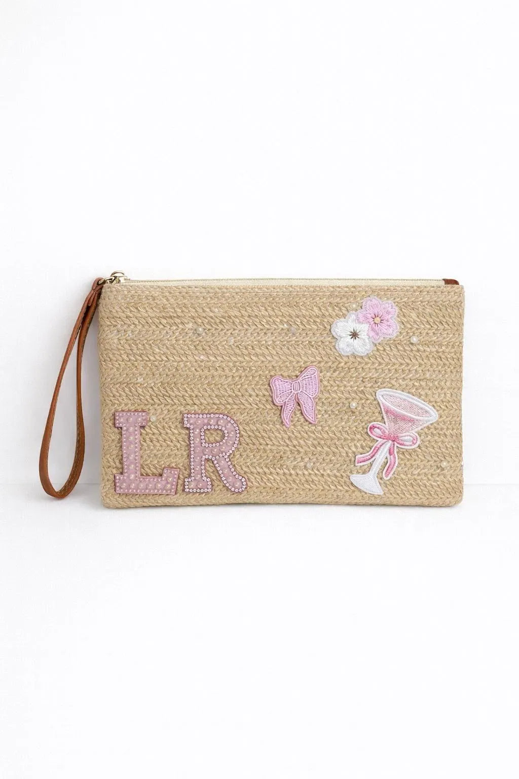 Beige woven clutch holiday beach club bag with light pink patches